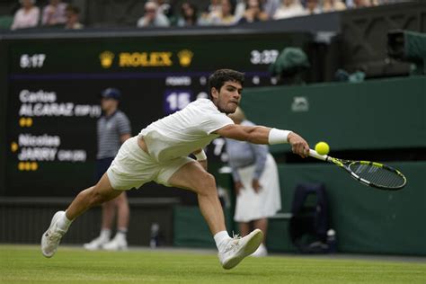 At rainy Wimbledon, Alcaraz among those playing day after day — and winning